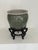 Large vintage hand-painted ceramic cachepot by Oriental Accent featuring a rich emerald green glaze with gilt geometric...