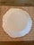 Elegant handcrafted ceramic charger by celebrated Parisian atelier Astier de Villatte. Measuring an impressive 12.5 inches...