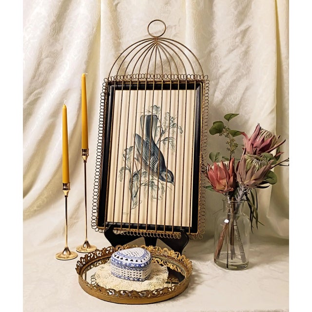 This exceptional mid-century find showcases a masterful intersection of fine art and high-style Hollywood Regency product...