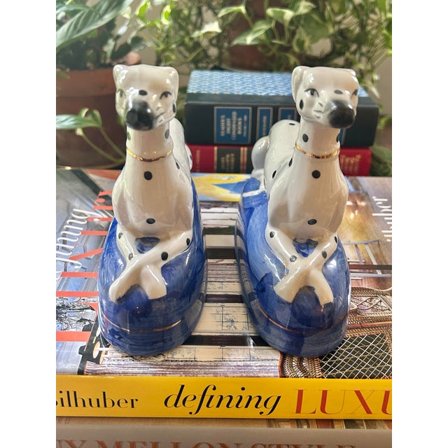 This vintage pair of ceramic Dalmatian dog bookends was designed in the spirit of classic Staffordshire mantel figures....