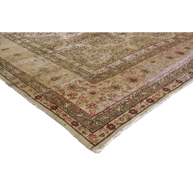 72742 Distressed Antique Persian Kermanshah Rug, 09'05 x 13'02. This hand-knotted wool Persian Kermanshah rug from the...