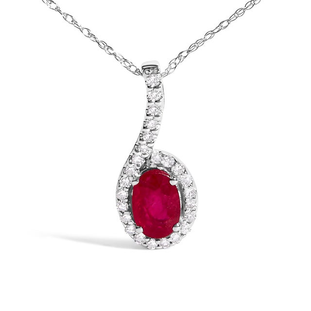 Discover elegance encapsulated within the 10K White Gold Red Ruby and Diamond Accent Teardrop Pendant Necklace. Crafted...