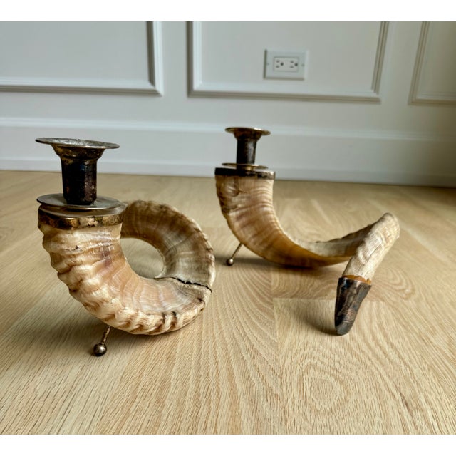 Pair of vintage natural ram’s horn candlesticks. Beautifully crafted from genuine ram’s horns, each is fitted with...
