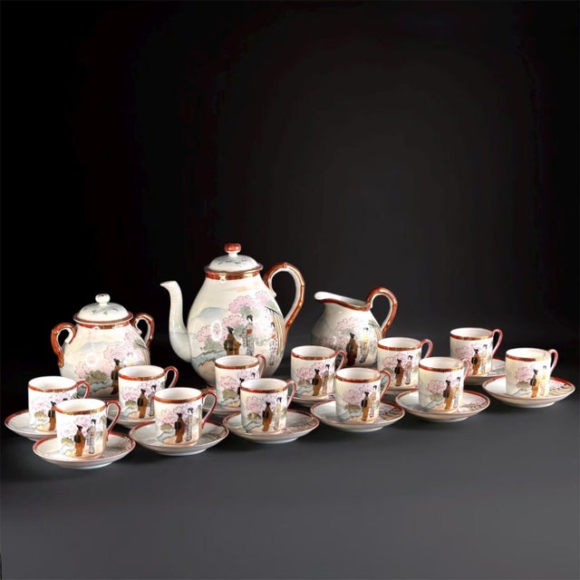 Beautiful and rare Japanese Satsuma porcelain tea set for twelve, dating to the early 20th century (c.1920–1940). Each...