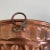 A set of Wagner copper West Germany bundt pans, tin lined. Each has a circular hook on the exterior rim. These have been...
