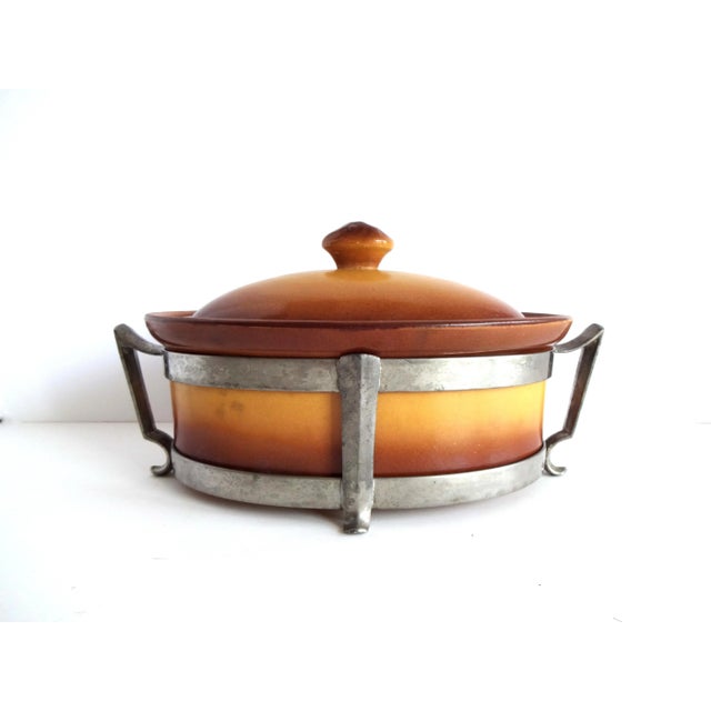 A vintage French La Silicite brown ceramic faience oven casserole cookware piece with a lid and metal serving base (the...