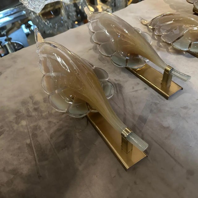 These are 1970s Mid-Century Modern wall sconces designed by Franco Luce. The sconces feature a striking leaf-shaped design...