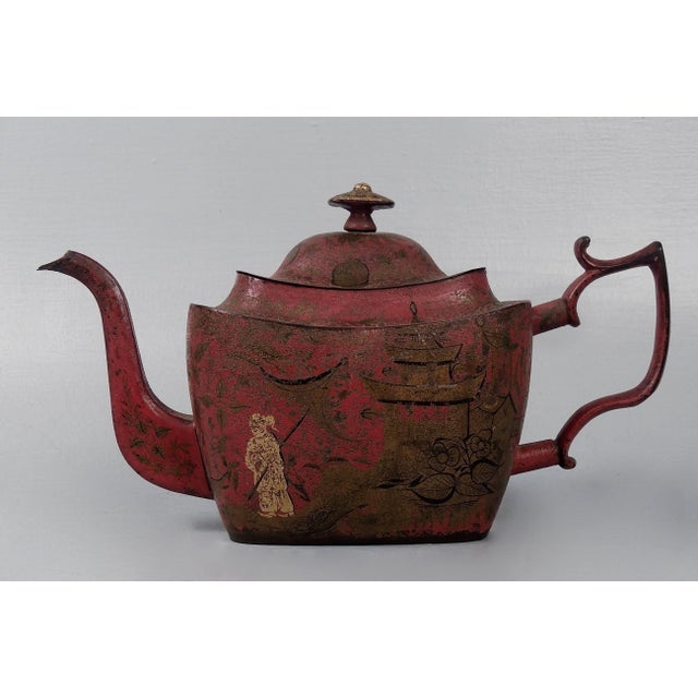 A fine georgian red tole paint or toleware teapot. This late 18th century piece is chinoiserie decorated throughout in...
