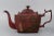 A fine georgian red tole paint or toleware teapot. This late 18th century piece is chinoiserie decorated throughout in...