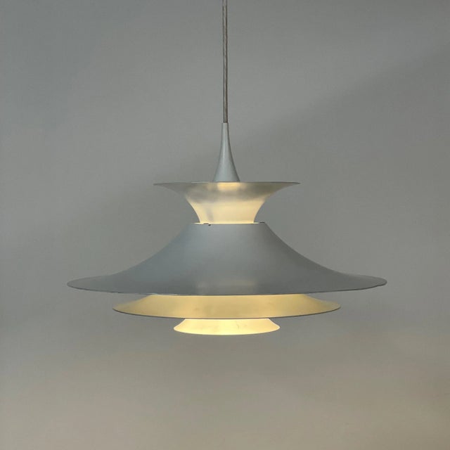 Fog & Mørup pendant Radius designed by Eric Balslev in 1977. This beautiful hanging lamp gives a very nice light effect...
