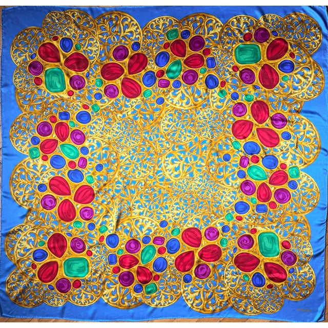 CHANEL large, heavy silk scarf depicting Gripoix jewelry intertwined with the famous CC logo. A blue border frames a...