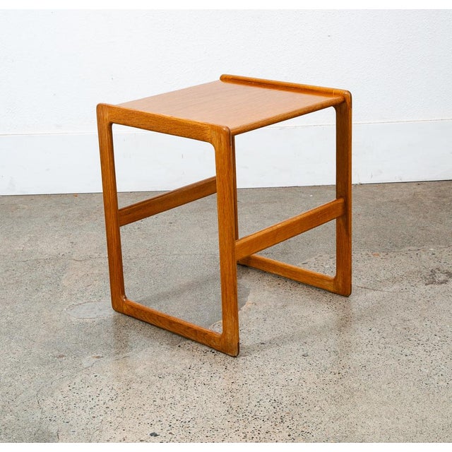 Unique and well constructed low Danish modern oak side table. Comes in Solid oak + oak veneer. The piece offers unique...