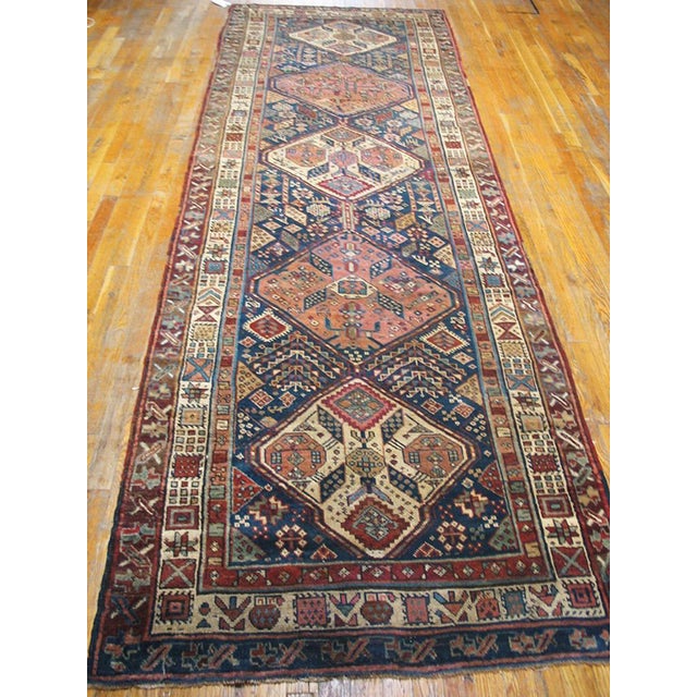 Antique Persian Kurdish rug. Size: 3'9" x 11'8". Antique Kurdish Iran Knotted Rug, Circa Date: 1930s. This exceptional...