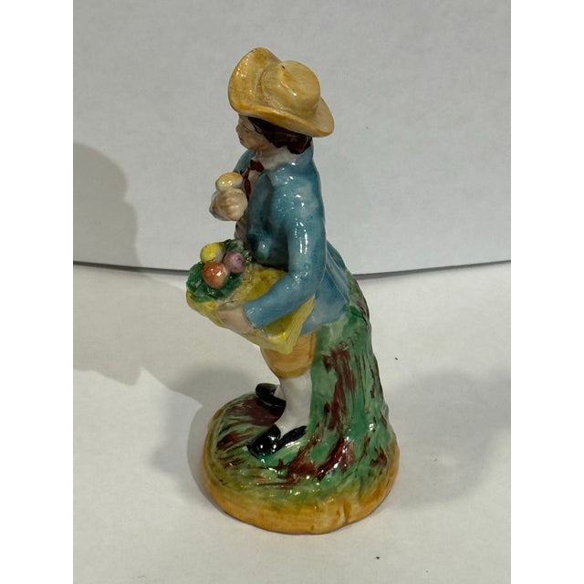 Mid 19th Century Vintage Staffordshire Fruit Seller figurine. It has hand painted details. The colors are vibrant and...