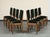 Set of eight (8) midcentury French oak cerused oak dining chairs, c. 1945. The seats and backs have been newly upholstered...