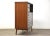 A mid century modern walnut tall dresser with canted legs and steel drawer pulls made by Hooker Furniture. 42” wide. 18”...