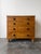 A classic antique 19th century English pine chest of drawers with contrasting black knobs. Two over three drawer...