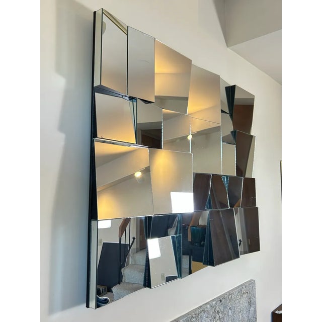 Attributed to Neal Small, this large faceted wall mirror titled “Slopes” is a masterful study in geometry, light, and...
