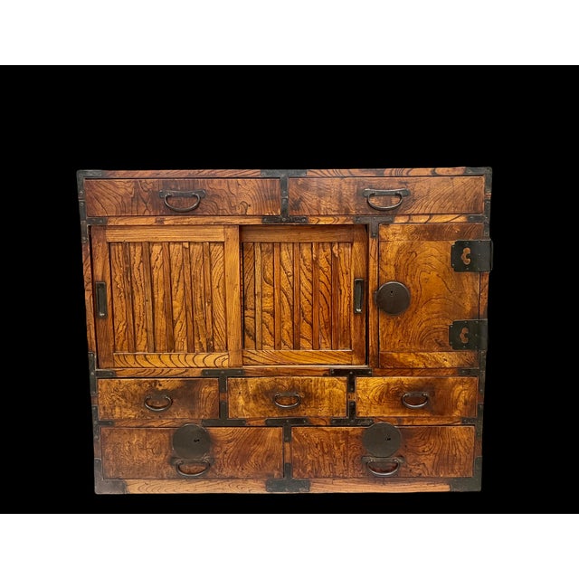 A late Meiji/Early Taisho Japanese Tansu merchant’s cabinet constructed ofJapanese Zelkova & cedar, with an asymmetric...