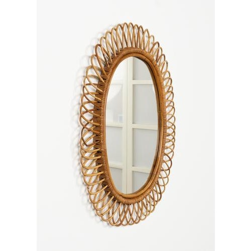 Midcentury beautiful oval wall mirror in bamboo and rattan by Franco Albini. Made in Italy in the 1960s. A highly...