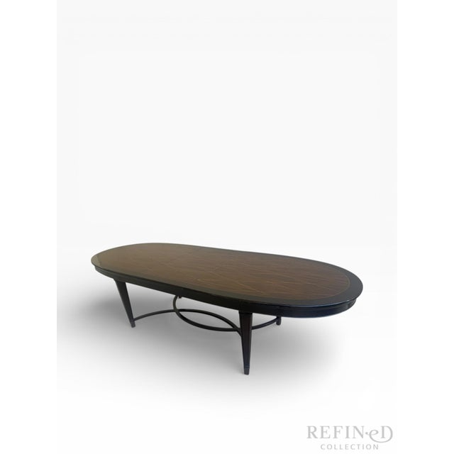 This refined dining table is attributed to the Ralph Lauren collection for Henredon, reflecting the brand’s hallmark...