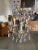 An elegant 20th Century Hollywood Regency crystal and brass chandelier. This chandelier has three light that have been...