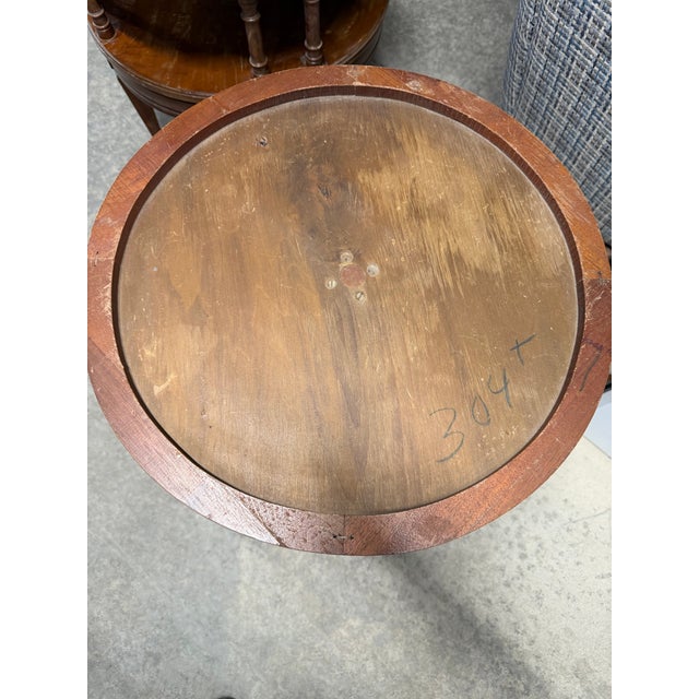 round top with a distinctive recessed inner surface, an ornate drop-pendant (or teardrop) carved apron, and a classic...