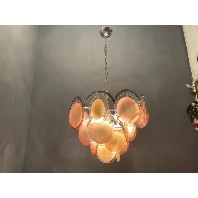 Murano glass disc chandelier 1970’s each murano glass disc various in shape color and size as hand blown. chrome frame...