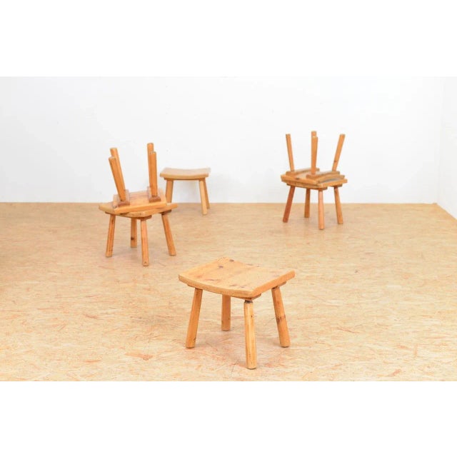 This vintage stool is made of solid wood.