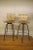 Vintage metal and wood stools in the manner of Arthur Umanoff. These swivel stools are in nice vintage conditon.