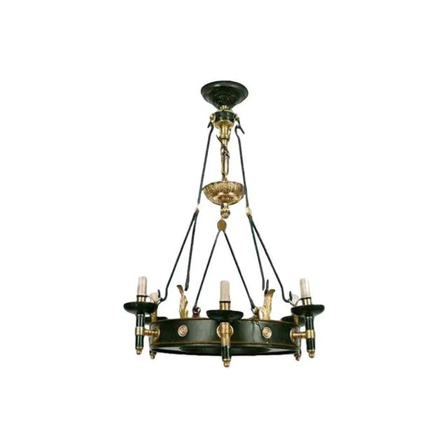 A Maison Jansen Regency style six-arm painted iron and bronze chandelier, circa 1940 Dimensions: Height 30", diameter 21".