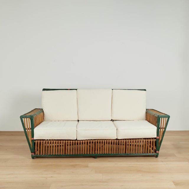 Impressive group of four pieces of art deco porch furniture crafted in rattan in streamline form and highlighted with...
