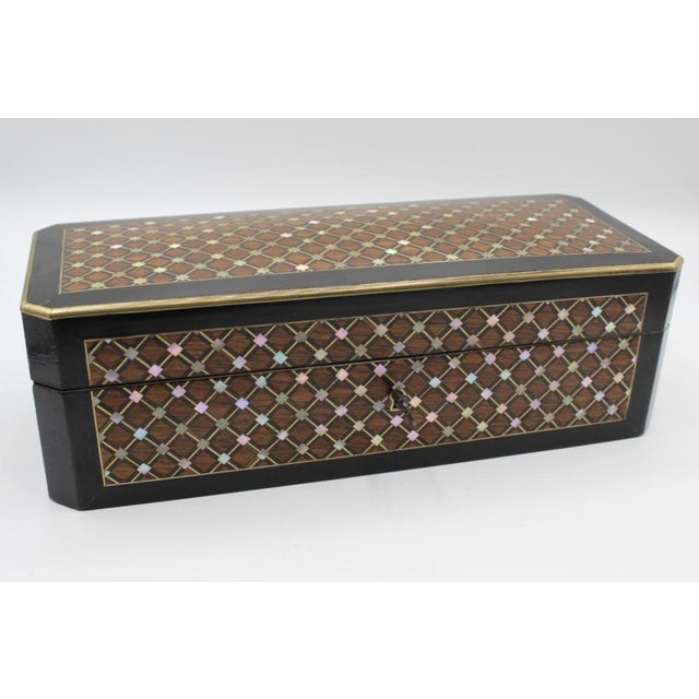 Glove box in marquetry of rosewood, brass and blackened wood, Napoleon III period, signed on the lock Tahan Paris, inlaid...
