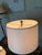 A Haig table lamp featuring a fluted column design with brass accents and a stepped square base. The architectural form...