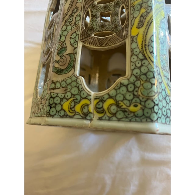 A vintage Chinese decorative incense lantern, featuring an octagonal shape with openwork panels, a stylized dragon motif...