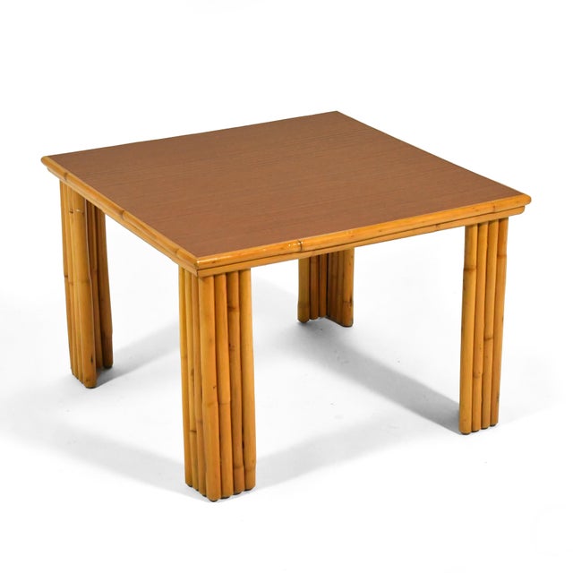 This lovely table by Ficks Reed can serve as either a coffee table, an end table, or a corner table when paired with the...