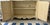 Elegant Ardley Hall two-door cabinet featuring a beautifully distressed antiqued cream finish with subtle crackle...