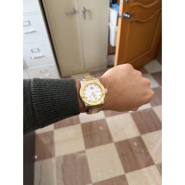 Early 20th Century Corum Romulus 18k Rose Gold 2-Tone Champagne White Dial 42mm Watch Full Set For Sale - Image 11 of 12