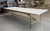 A Paul Mccobb for the Irwin Collection of Calvin Furniture Brass bottom coffee table with a white glass top. The table has...