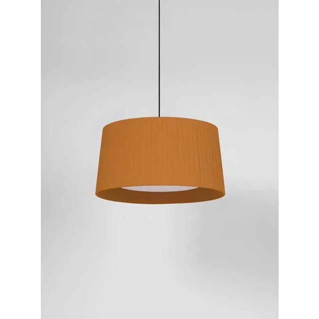 Mustard gt5 pendant lamp by santa & cole dimensions: d 62 x h 32 cm materials: metal, ribbon. Available in other colors....