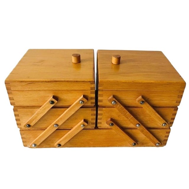 This vintage Danish design, folding wooden sewing box (or craft box) from the 1960s is incredibly handy for neatly storing...
