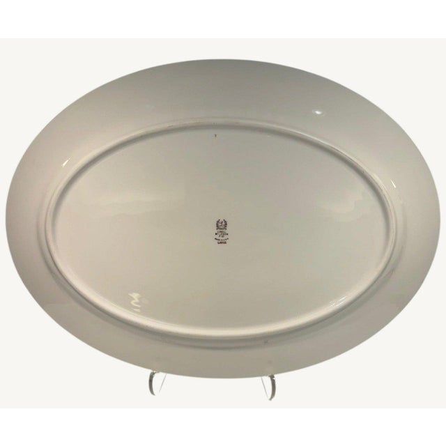 Beautiful vintage condition with a glossy ivory finish and richly detailed gold decoration. The photographs show an...