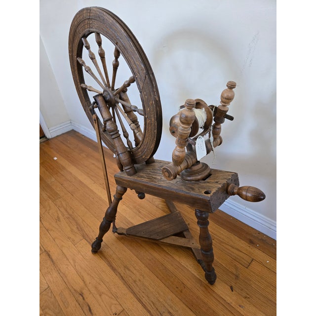 Antique Saxony style spinning wheel. It has a few minor cracks and small areas of damage as shown in the photos but...