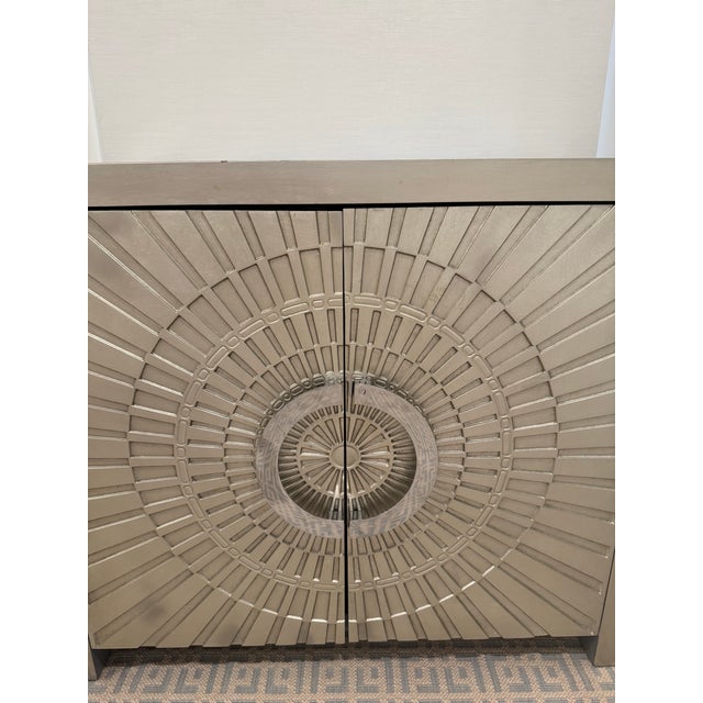 Styled after Jonathan Adler Talitha Cabinet for a lot less. It is made of wood with a silver metal leaf style finish on...