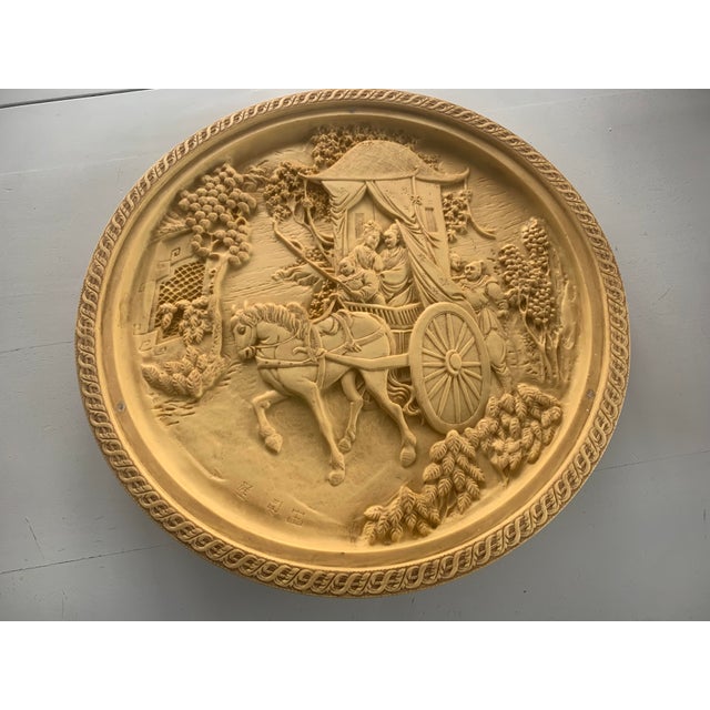 A beautiful painting made of alabaster, in my opinion, once served as a table top. However, someone had a very...