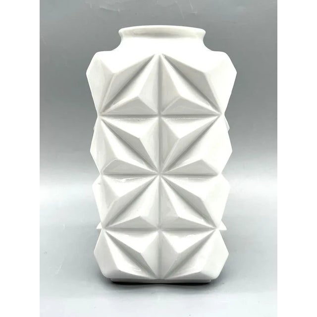 A striking porcelain vase, made by Schumann in Arzberg, Bavaria, Germany. The geometric relief structure with sculptural...