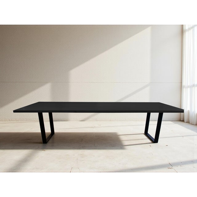 The sophisticated Kuro Dining Table, where premium American craftsmanship meets contemporary design. This stunning piece...