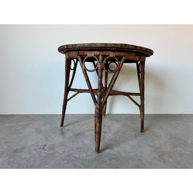 This charming vintage Boho chic round accent table is a perfect blend of natural materials and artistic craftsmanship....