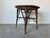 This charming vintage Boho chic round accent table is a perfect blend of natural materials and artistic craftsmanship....