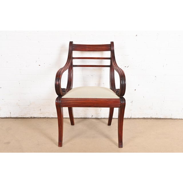 A gorgeous Regency or Empire style dining captain chair, armchair, or side chair Baker Furniture, "Milling Road"...